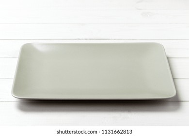 empty rectangular Plate on wooden table background.