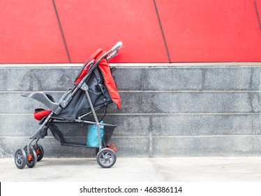 Empty Red Baby Stroller