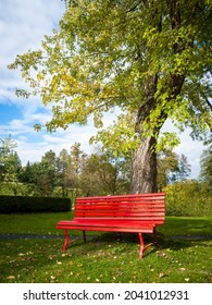Empty red bench in a park
