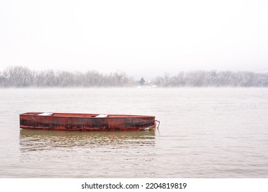 Empty Red Boat In Misty River In Winter