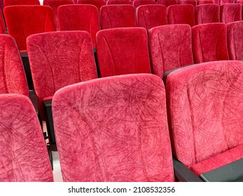 Empty Red cinema seats or theater seats lined up side by side, perspective photo
