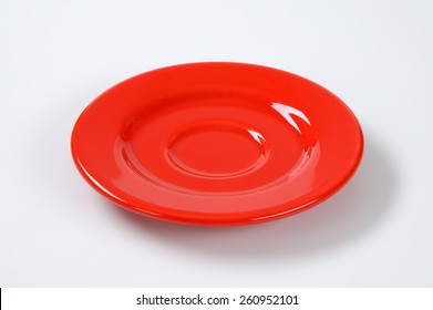 Empty Red Saucer On White Plate