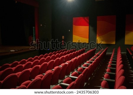 Empty red seats in a theater before a performance