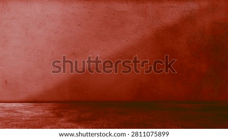 Empty red studio room background with concrete wall and floor. Abstract dark terracotta plaster textured corner backdrop for product placement, showcase display, stage, or presentations.