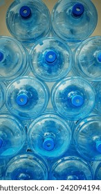 Empty refillable water bottles close up background