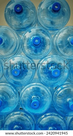Empty refillable water bottles close up background