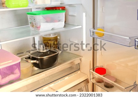 Empty refrigerator. Concept of poverty idea, food crisis, gluten allergy and celiac disease. Drought, famine and epidemic concept. 