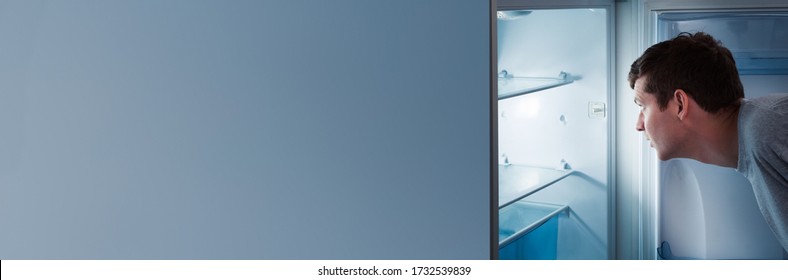 Empty Refrigerator. Hungry Man Opening Fridge Door 