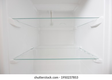 An empty refrigerator. Inside an empty, clean refrigerator, a refrigerator compartment after defrosting.
