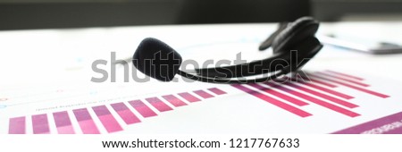 Empty remote office workplace with laptop pc and headset closeup. Receptionist or secretary of contact data center desktop keyboard device desk table ip telephony or callcenter voice message system