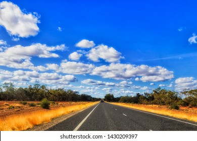 Empty remote road through outback of distant part of NSW state in Australia on a sunny day in flat plain area of wheat belt and Castlereagh highway leading to Lightning ridge town.