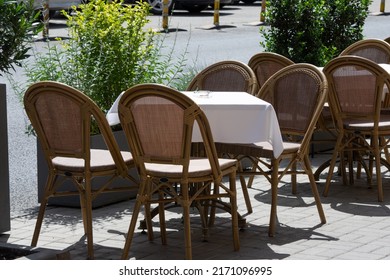 Empty restaurant chairs with no people to use them and an ashtray on table. Horeca industry businesses failing during pandemic times
