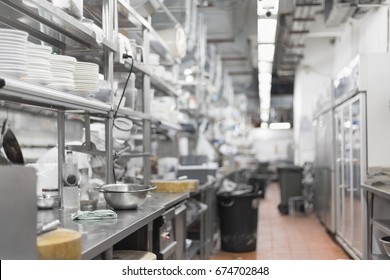 Empty Restaurant Kitchen Is Blurred For Background