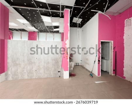  an empty retail space with scattered boxes and shelves.
