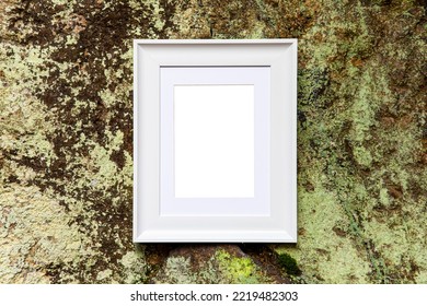 Empty Retro Ancient Frame Mockup With Copy Text Space On Mossy Rock Wall Texture