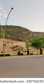 empty road between the mountains