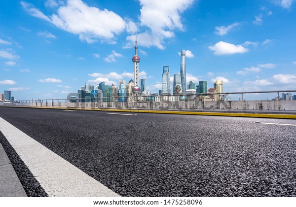 empty road with city\
skyline