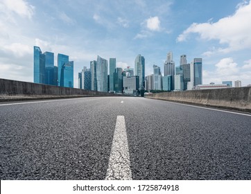 Empty Road With City Skyline In Singapore