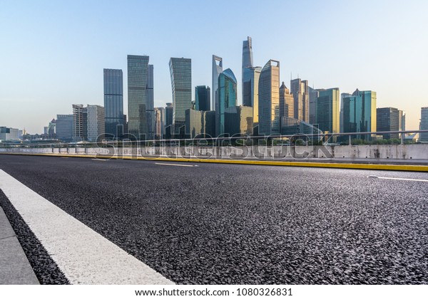 empty road with\
cityscape in shanghai\
china