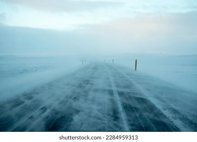 Empty road covered by snow storm in the north of Iceland