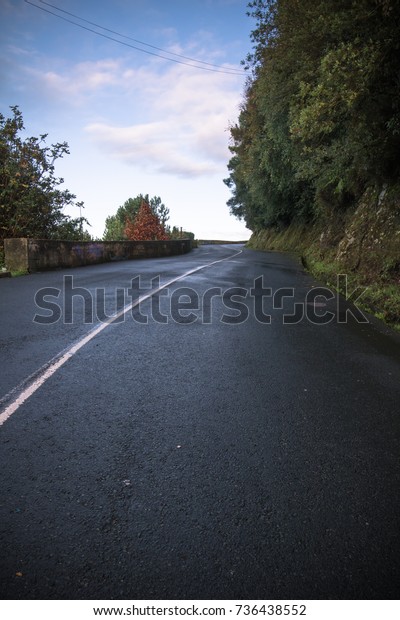 empty road curve leading up on a\
mountain, monte igueldo, san sebastian, basque country,\
spain