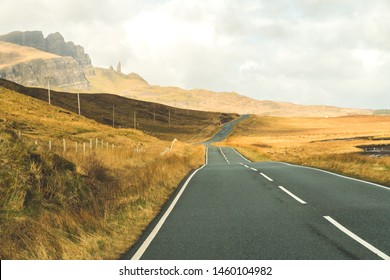 empty road in the desert with clouds, isle of skye scotland, the old man of storr