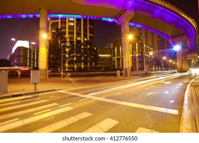 Empty road floor with city elevated bridge of night scene