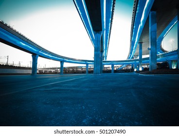 Empty road floor with city elevated bridge of night scene