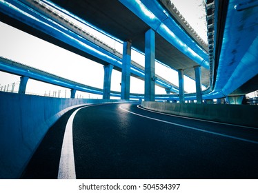 Empty road floor with city elevated bridge of night scene