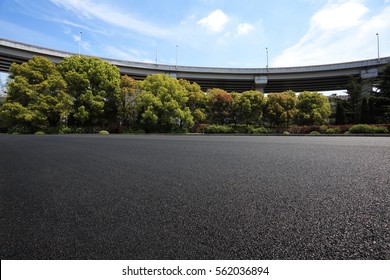 Empty Road Floor Surface With City Viaduct Overpass Bridge Background