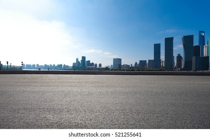 Empty Road Floor Surface With Modern City Landmark Buildings Of Shanghai Bund Skyline 