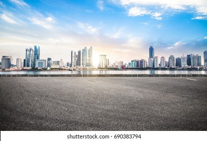 Empty road floor surface with modern city landmark buildings of chongqing bund Skyline of morning