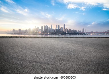 Empty road floor surface with modern city landmark buildings of chongqing bund Skyline of morning