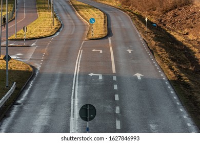 Empty road junction with one plus two lanes.