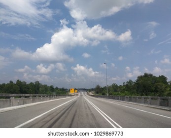 Empty road in middle of forest