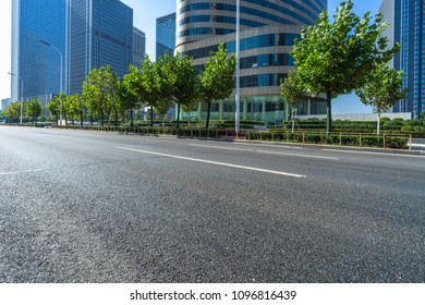 Empty Road And Modern Office Block Buildings Against Sky, China