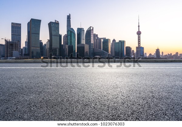 empty road\
with panoramic city in shanghai\
china