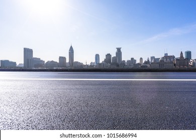 empty road with panoramic cityscape