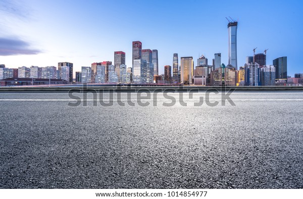 empty road with panoramic\
cityscape