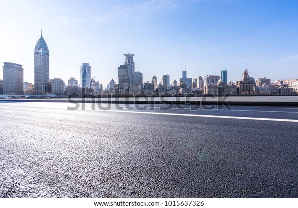 empty road with panoramic\
cityscape