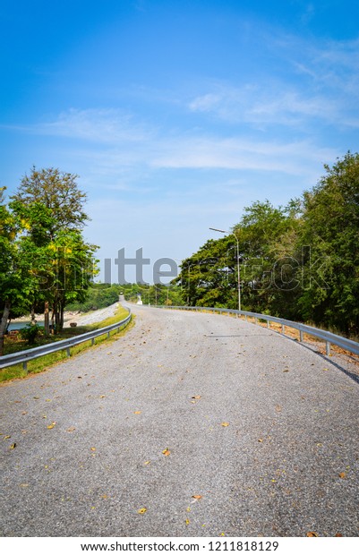 Empty road quiet in summer / Curve road winding\
street countryside to the forest\
