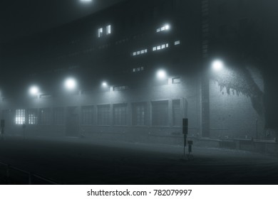 Empty road and streetlights at foggy night - Powered by Shutterstock