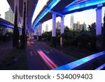 Empty road surface floor with city overpass viaduct bridge of night scene in shanghai