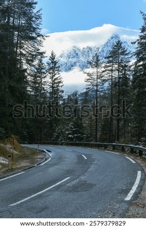 Similar – Image, Stock Photo Empty road surrounded by sea water near mountains