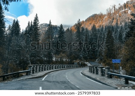 Similar – Image, Stock Photo Empty road surrounded by sea water near mountains