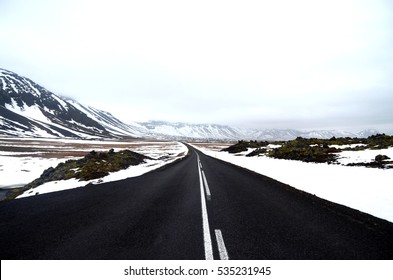 Empty road through snow