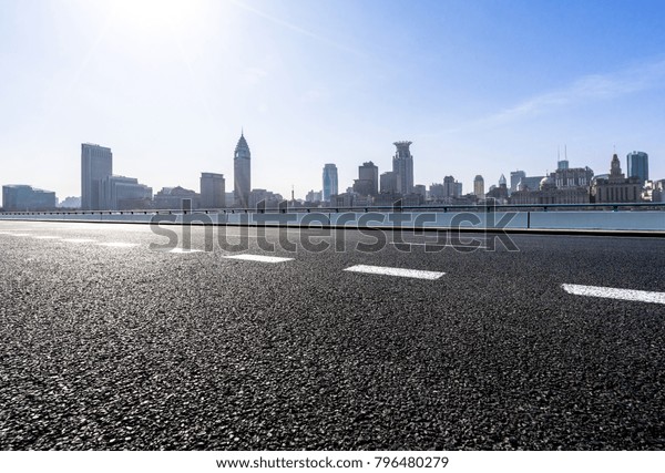 empty road wity\
panoramic cityscape in\
shanghai