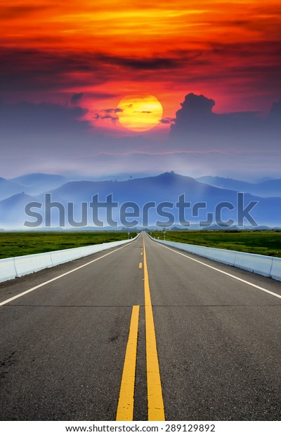Empty road and the\
yellow traffic lines
