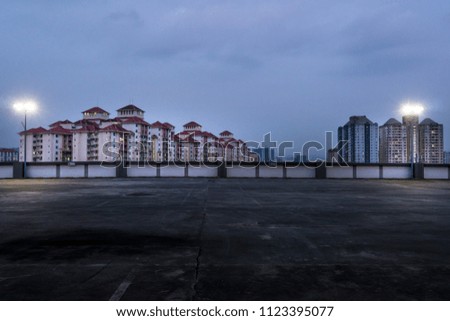 Empty rooftop parking at dawn