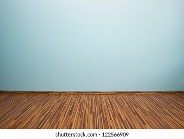 Empty Room With Blue Wall And Wooden Flor